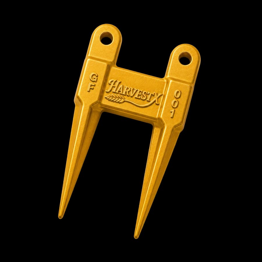 Gold HarvestX Guard Finger displayed beside its packaging